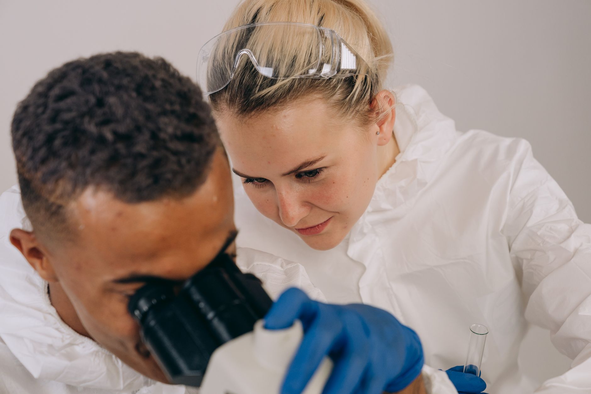 Scientist working in a laboratory with microscope