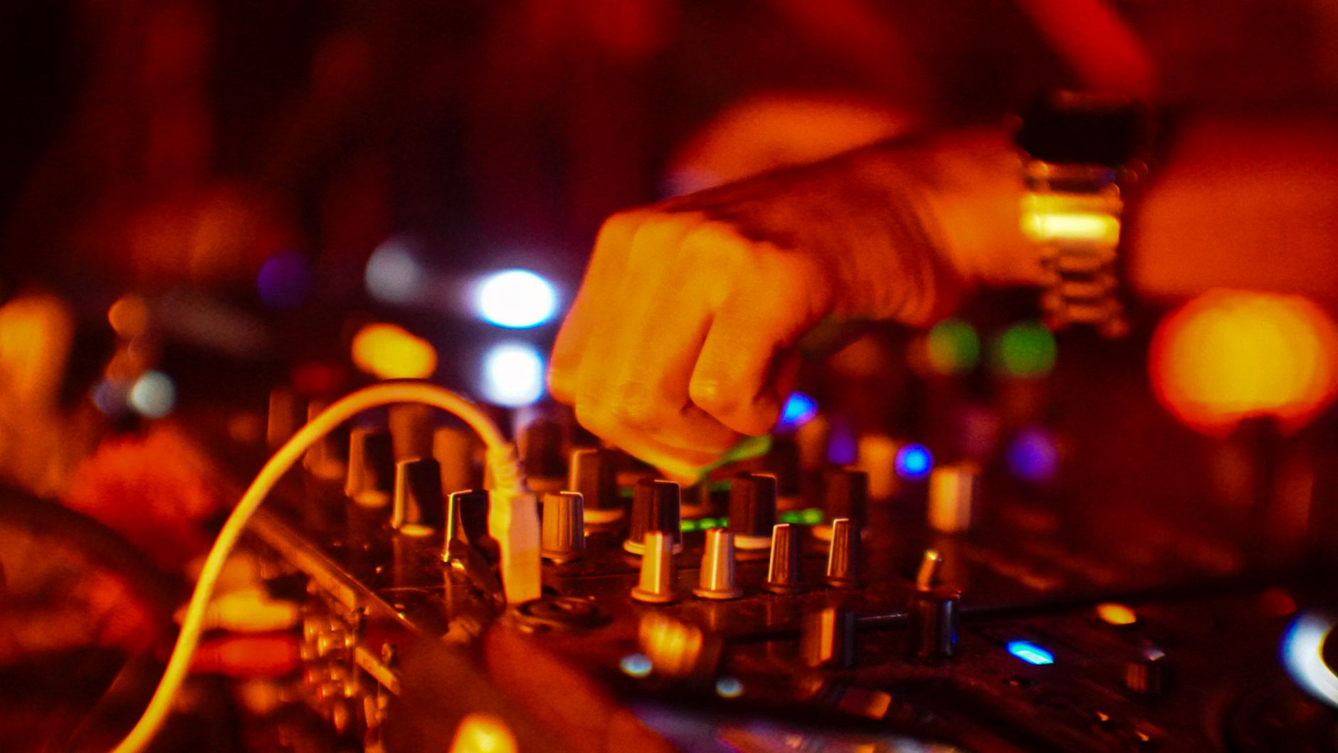 DJ mixing music at an outdoor festival