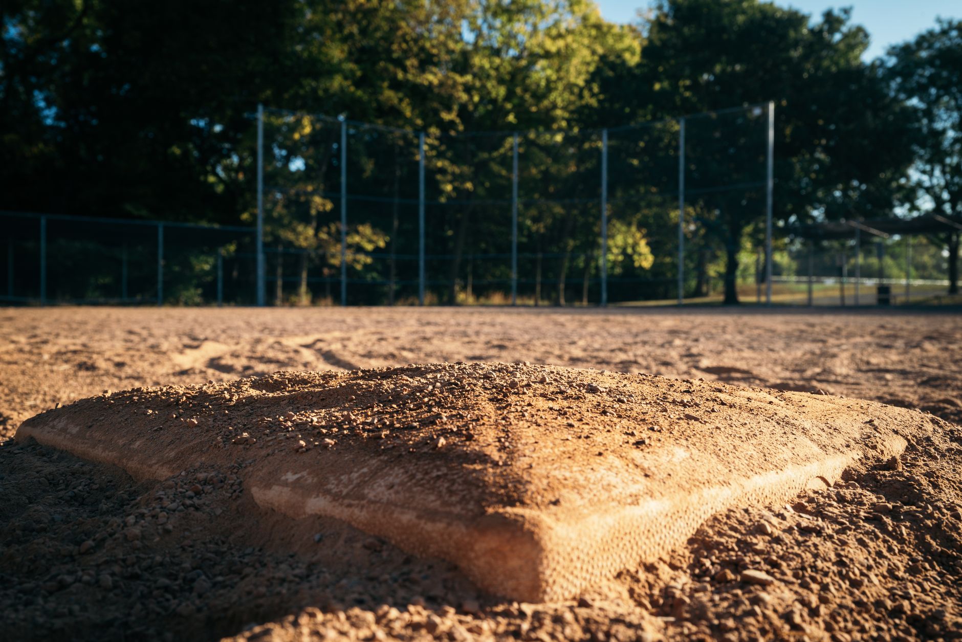 Baseball resting on the pitcher's mound dirt