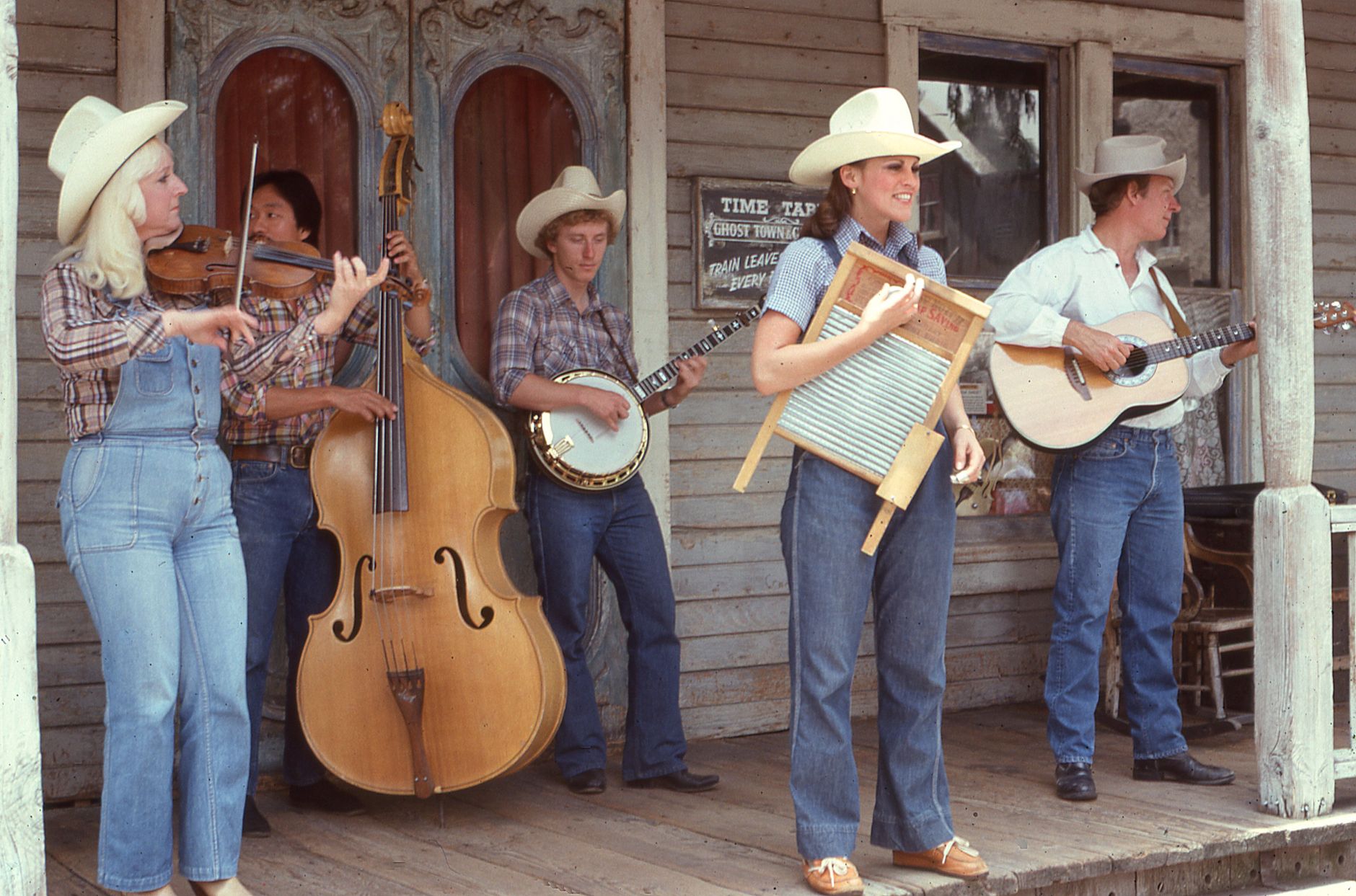 Musician playing a banjo, the instrument behind bluegrass and country picking styles