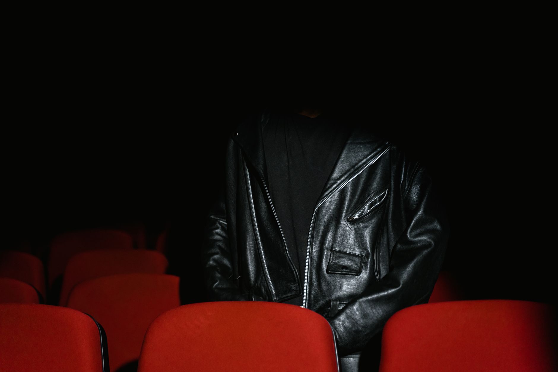 Movie theater popcorn and tickets in a dark cinema