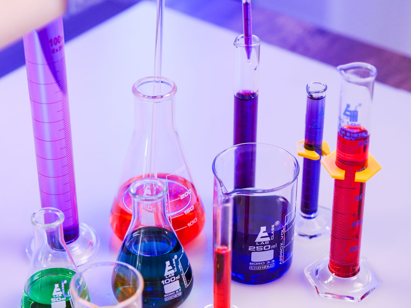 Chemistry laboratory glassware with colorful liquids