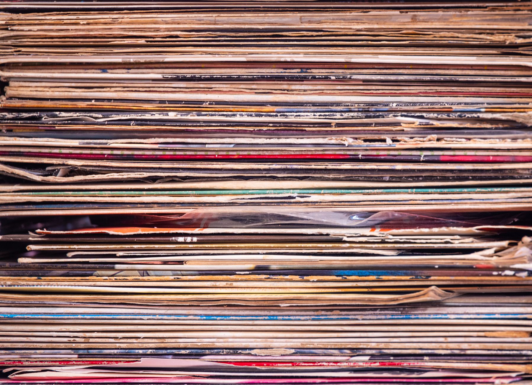Vinyl records lined up in a music collection