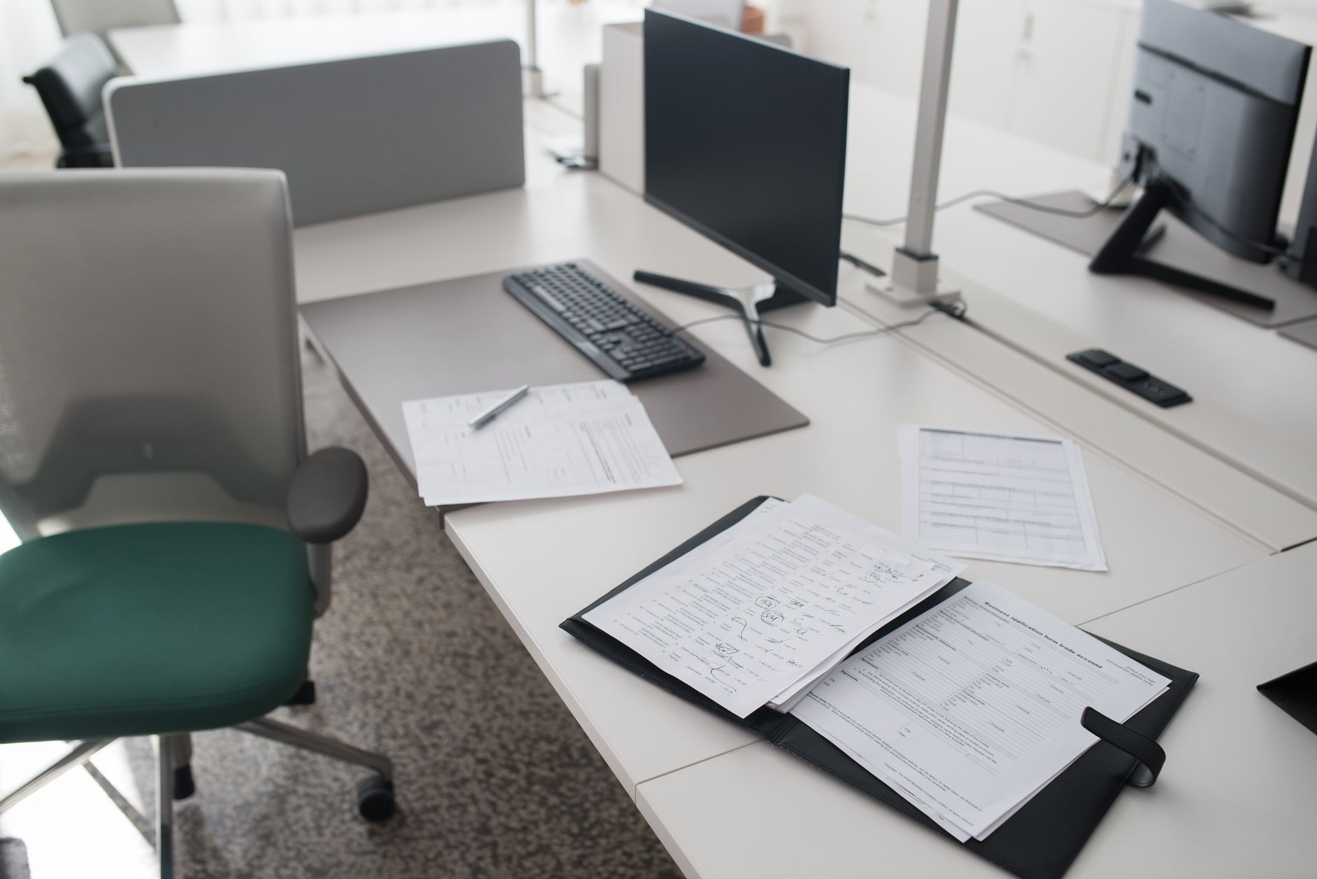 Stack of paper documents on an office desk
