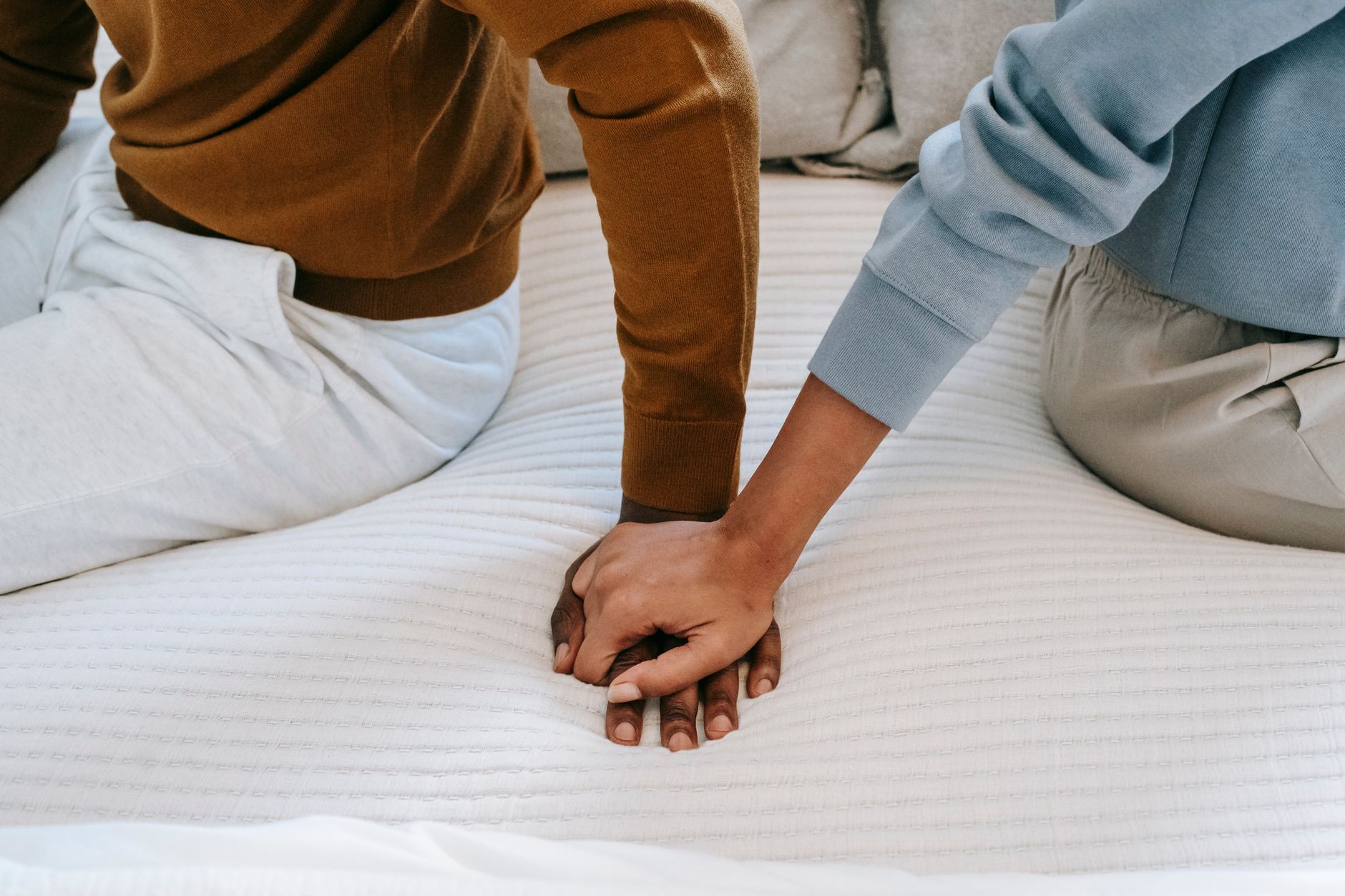 Couple holding hands — expressing love and affection
