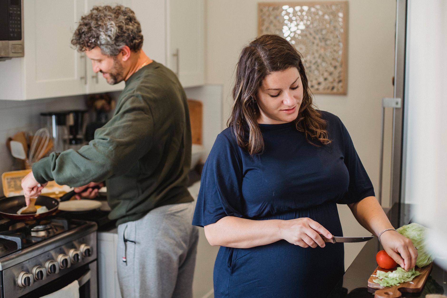 couple cooking together kitchen