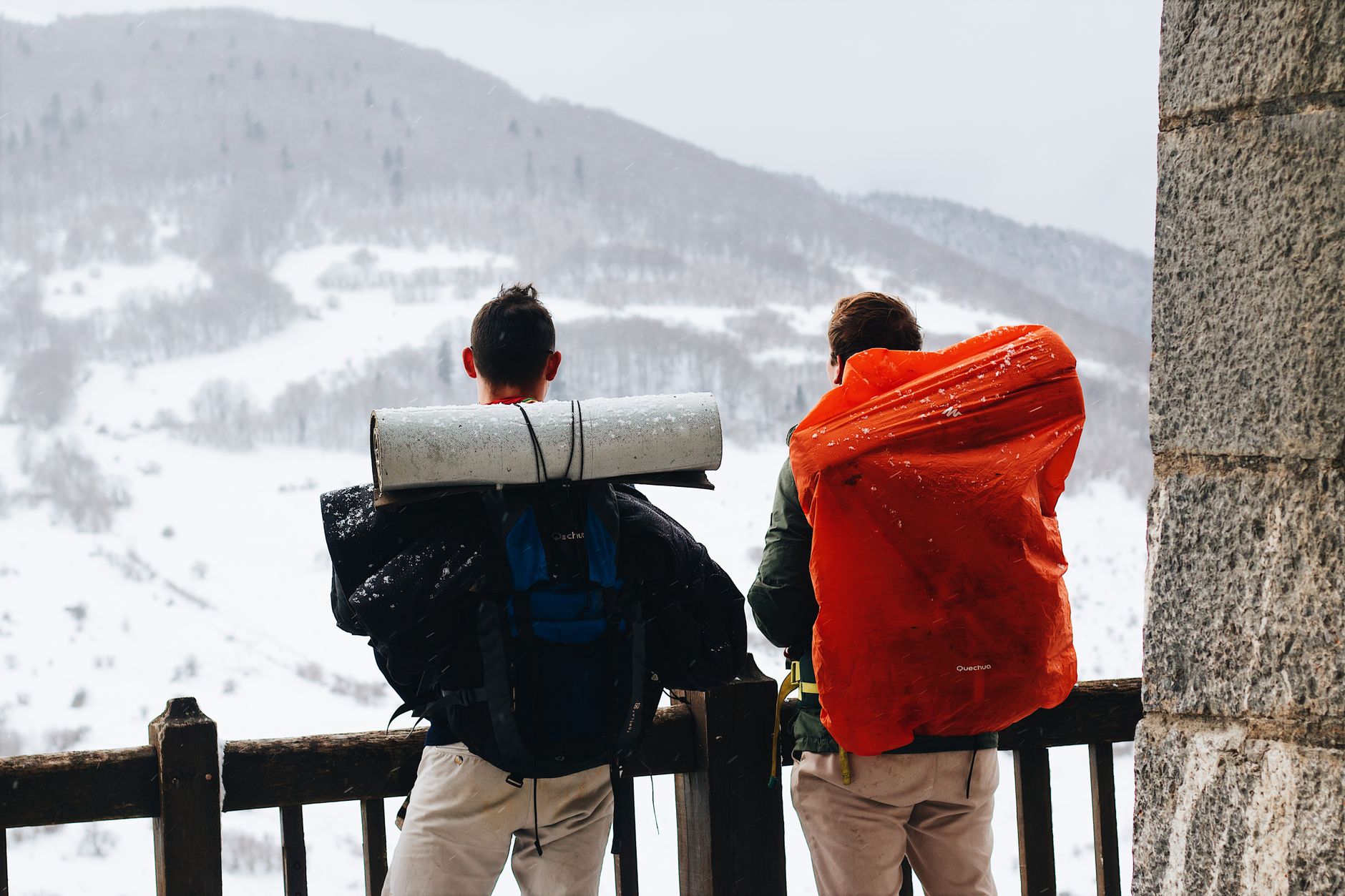 Hiker with backpack on mountain trail — adventure traveler