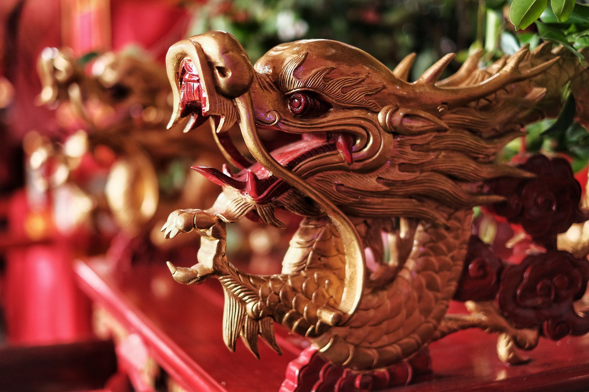 A fantasy dragon figure guarding a landmark